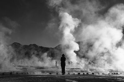 Rear view of man standing against sky