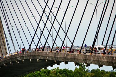 People walking on footbridge