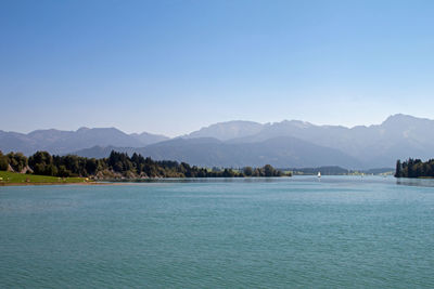 Scenic view of sea against clear blue sky