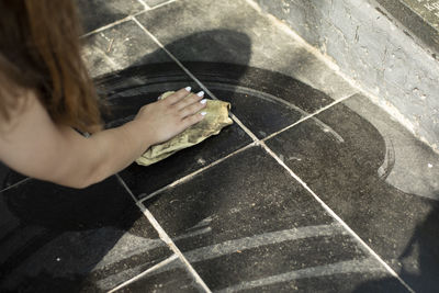 High angle view of woman holding hands in city