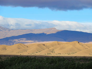 Scenic view of landscape and mountains against sky