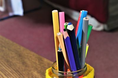 Close-up of colored pencils on table