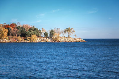 Beautiful evening sunset landscape at canadian ontario lake, clear blue sky with clouds