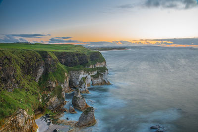 Scenic view of sea against sky at sunset