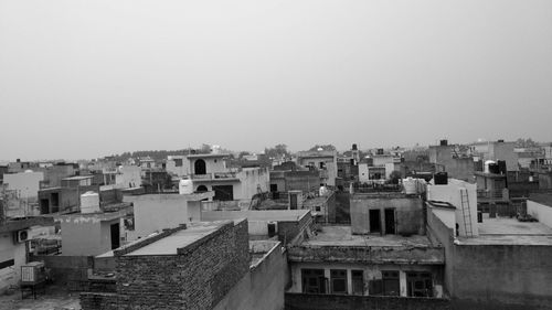 High angle view of buildings against clear sky