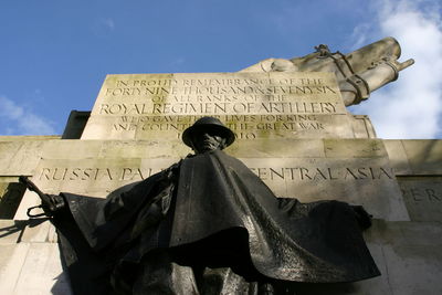 Low angle view of statue against sky