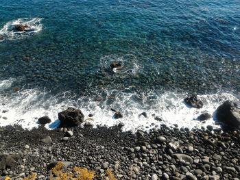 High angle view of surf on beach