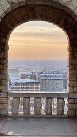 Buildings seen through arch bridge