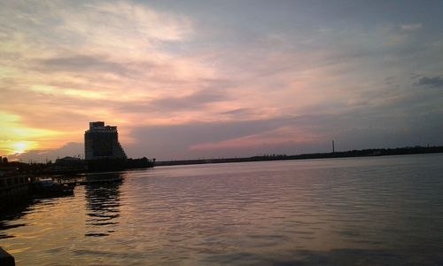 Scenic view of river at sunset