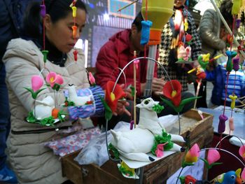 People at market stall