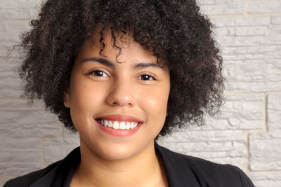 Close-up portrait of a smiling young woman