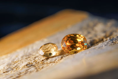 Close-up of wedding rings on table