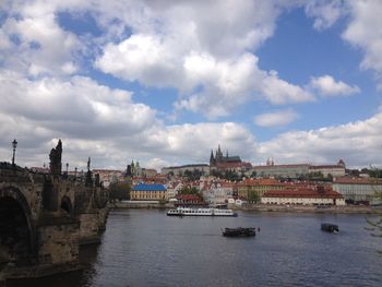 View of cityscape against cloudy sky