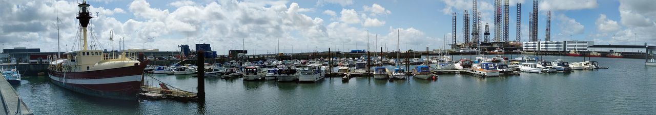 Panoramic view of boats moored at harbor