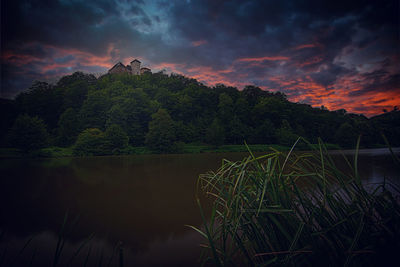 Scenic view of lake against sky during sunset