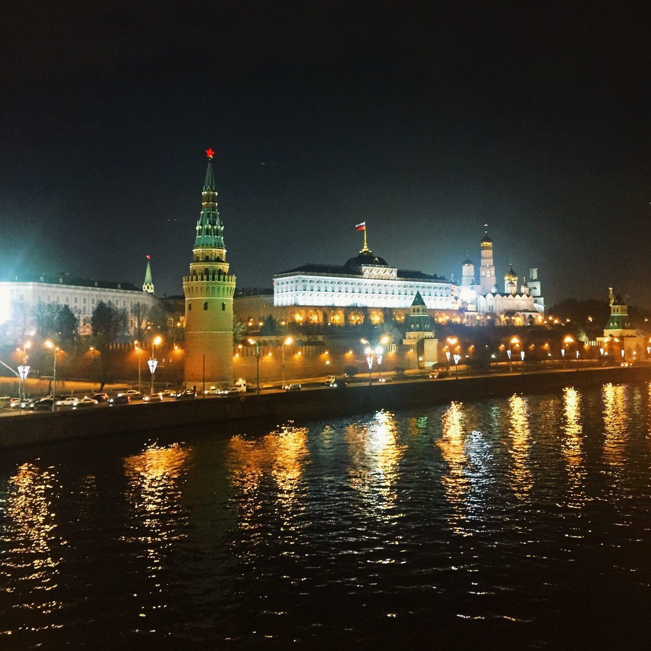 architecture, building exterior, illuminated, built structure, night, water, waterfront, reflection, city, river, famous place, travel destinations, clock tower, tower, tourism, international landmark, clear sky, travel, sky, capital cities