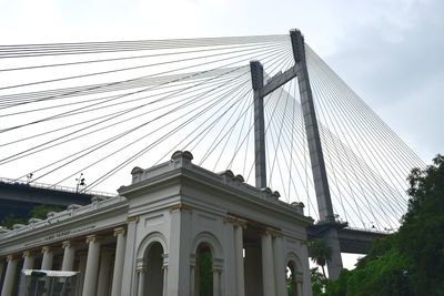 Low angle view of bridge against sky in city