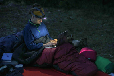 Side view of man using mobile phone