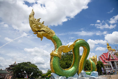 Low angle view of statue against sky