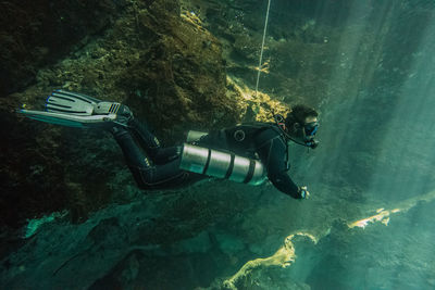 Man scuba diving in sea