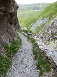 Road amidst mountains against sky