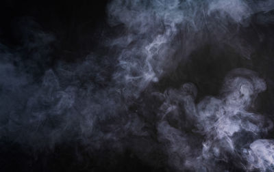 Abstract image of smoke against black background