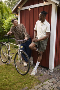 Rear view of senior couple sitting on street