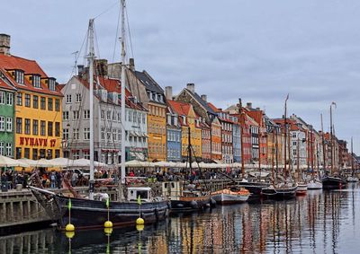Boats moored at harbor