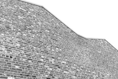 Low angle view of brick wall