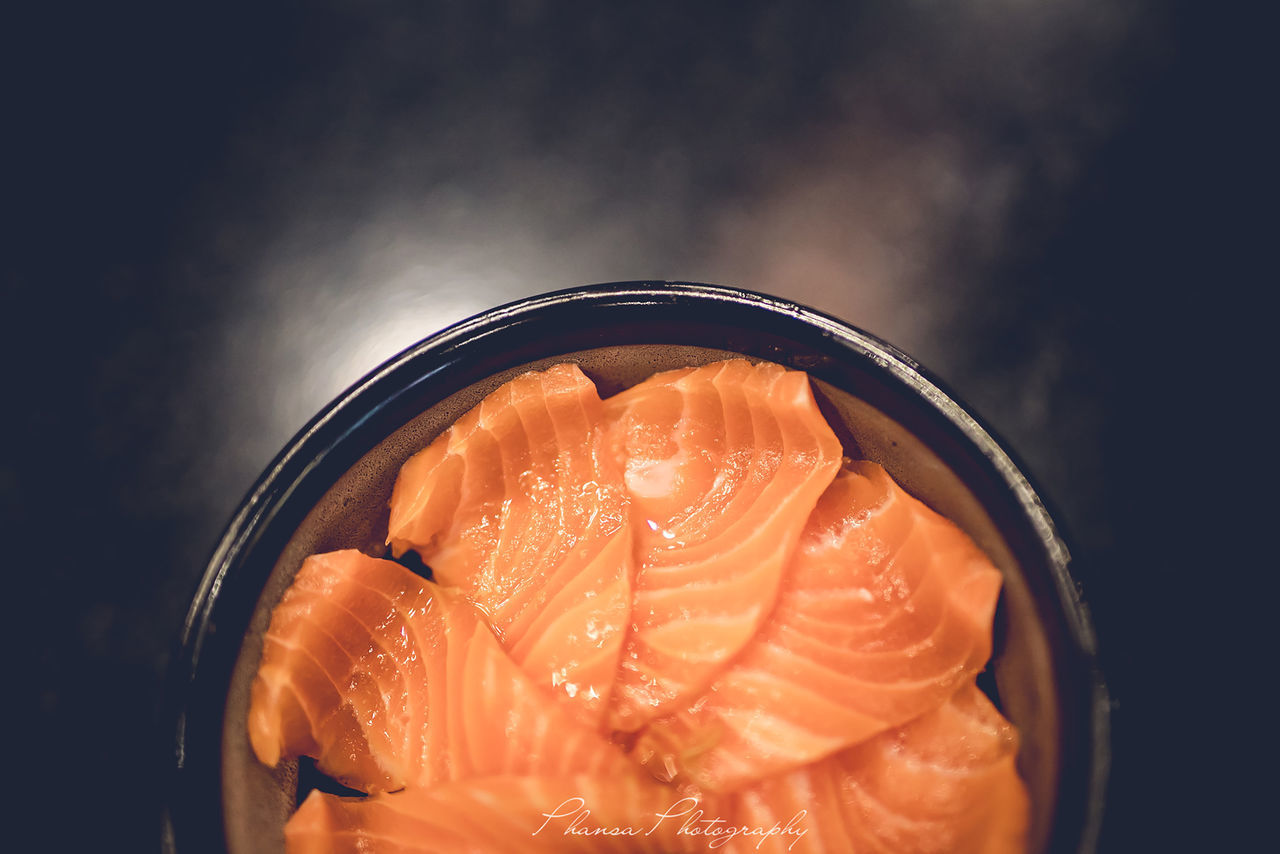 HIGH ANGLE VIEW OF ORANGE FISH IN CONTAINER