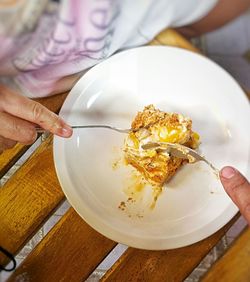 Close-up of woman eating ice cream in plate