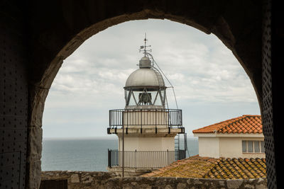 View of sea and buildings against sky