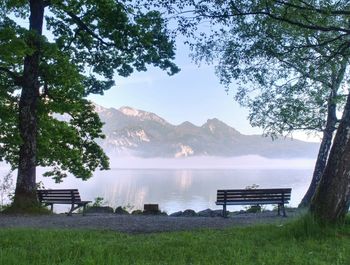 Empty bench at the lake beach. magnificent lake in south bavaria, germany. the concept of walking