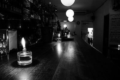 Illuminated lamp on table at home