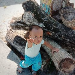 Portrait of cute boy on wood