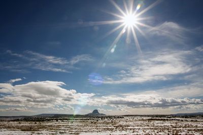 Scenic view of sun shining on sunny day