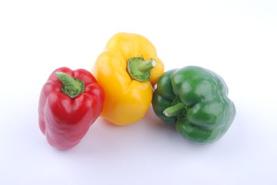 Close-up of bell peppers against white background