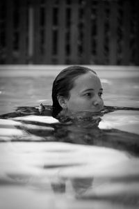 Portrait of woman swimming in pool