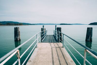 Bridge over sea against sky