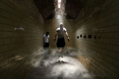 Full length of men in prison at eastern state penitentiary