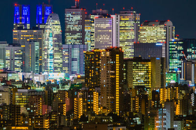 Illuminated buildings in city at night