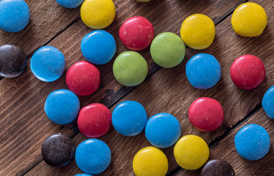 High angle view of multi colored candies on table