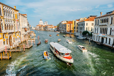 High angle view of canal amidst buildings in city