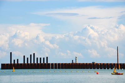 Panoramic view of boats sailing in sea against sky