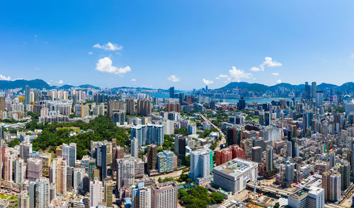 High angle view of modern buildings in city against sky