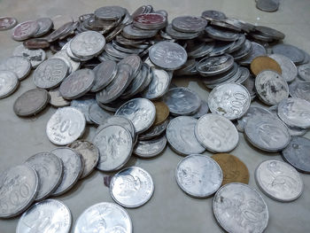 High angle view of coins on table