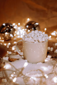 Close-up of christmas lights on table