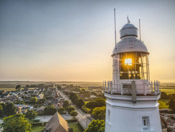 High angle view of illuminated buildings against sky during sunset