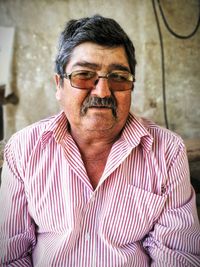 Portrait of smiling man wearing eyeglasses