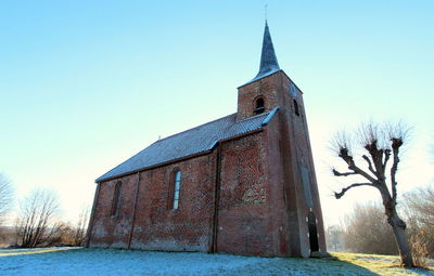 Low angle view of church against clear sky